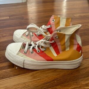 Converse high top platforms in sunburst pattern, size 7.